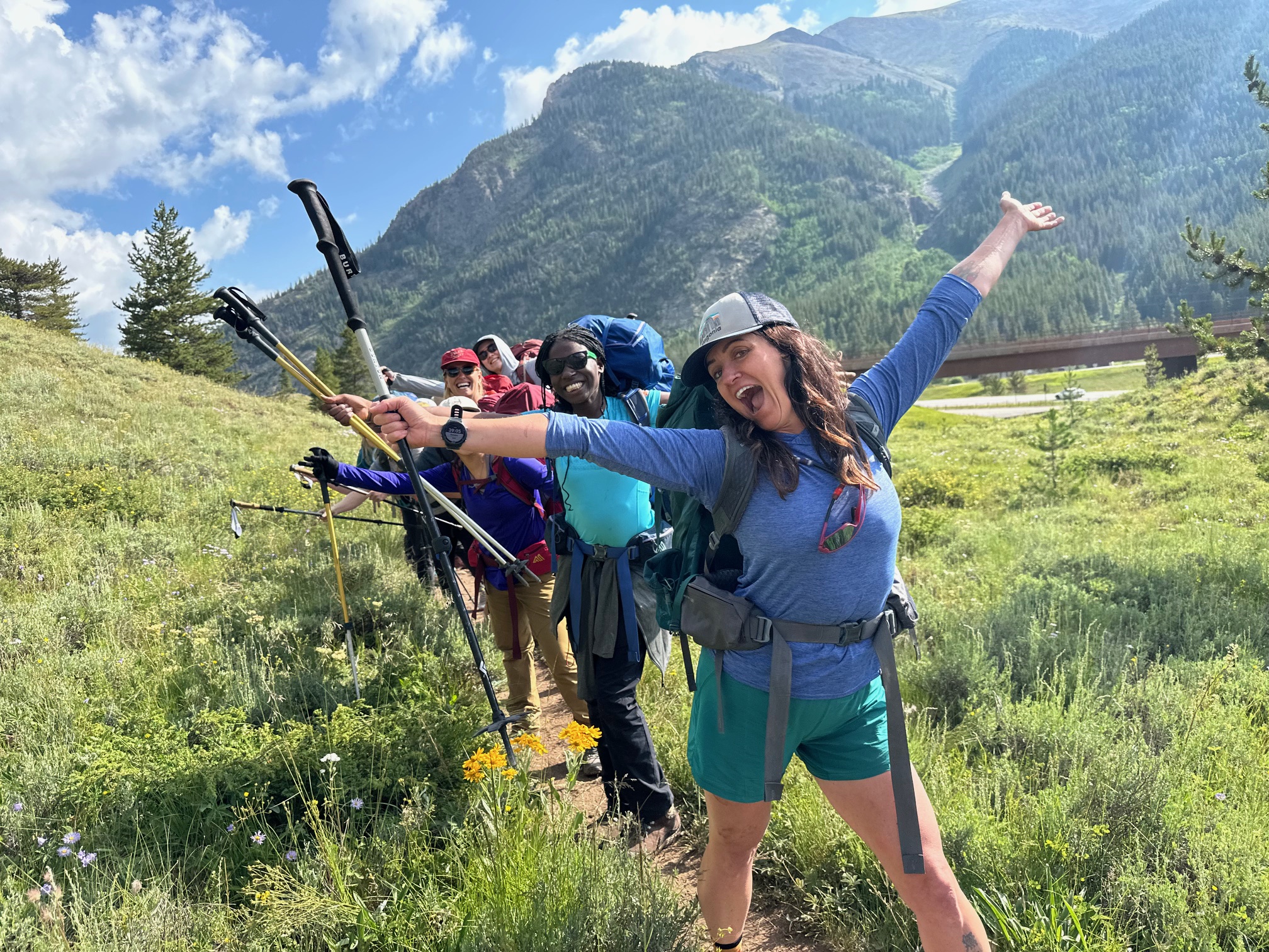 Girls smiling with their arms in the air