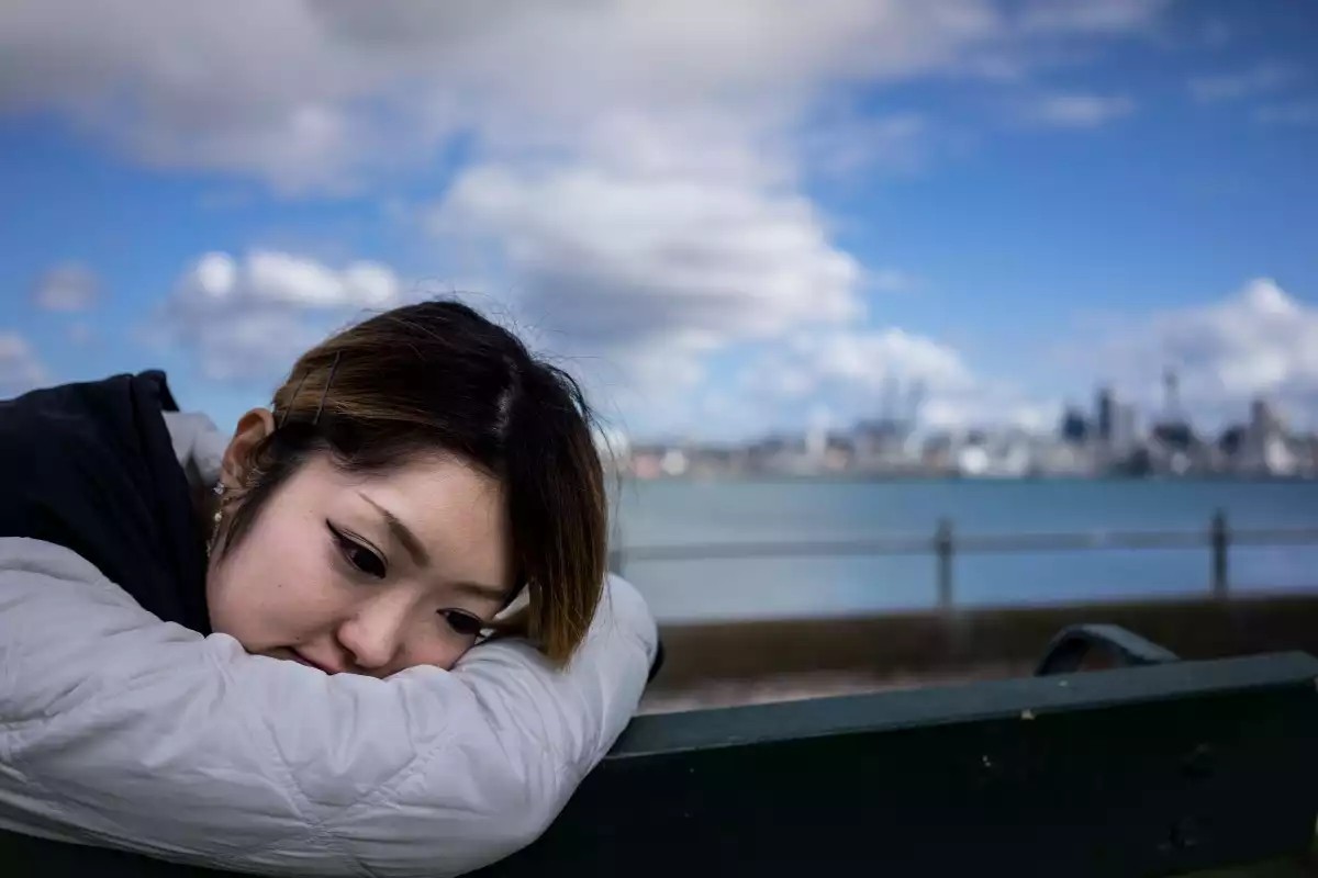 Girl resting her head on her arms