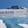 iced over lake and mountains 