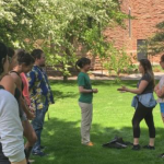 students outside discussing with eachother 