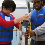 students holding equipment