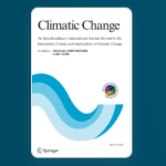Cover of the scientific journal Climatic Change. The title appears in large serif font at the top of a white background, followed by a brief subtitle. Below, an abstract wave pattern in shades of blue and teal curves upward from the edges. Minimalist and professional design