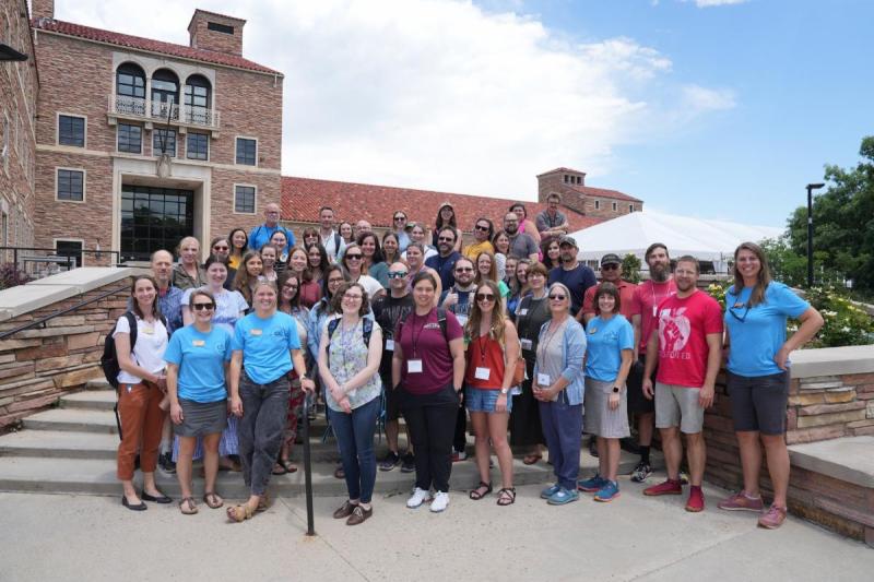 Group of people standing outside on stairs