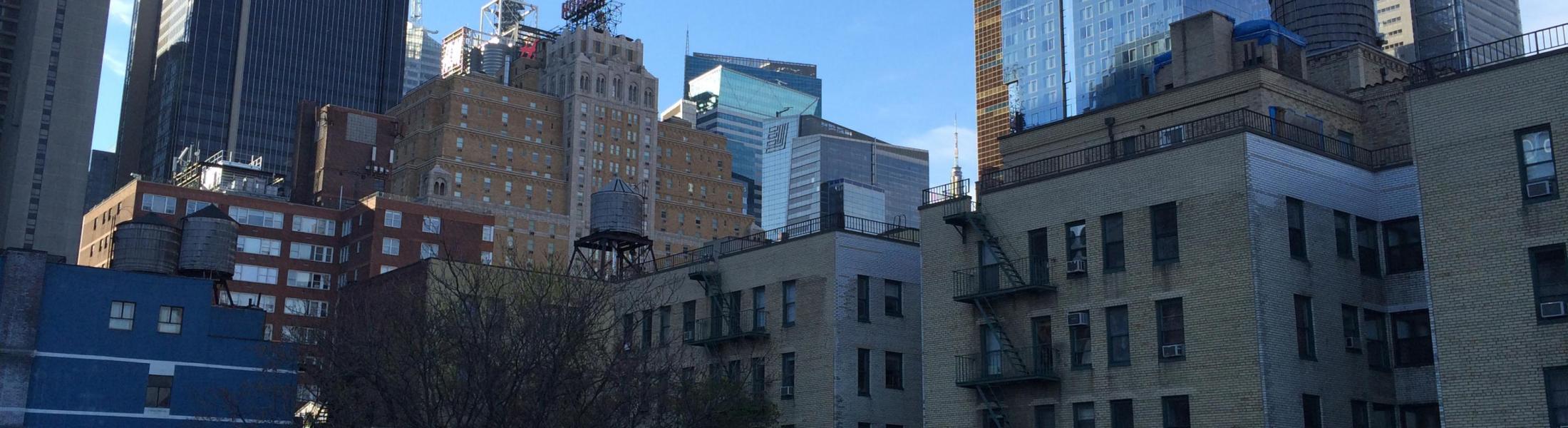 multiple buildings cluster to form New York skyline, seen from Midtown