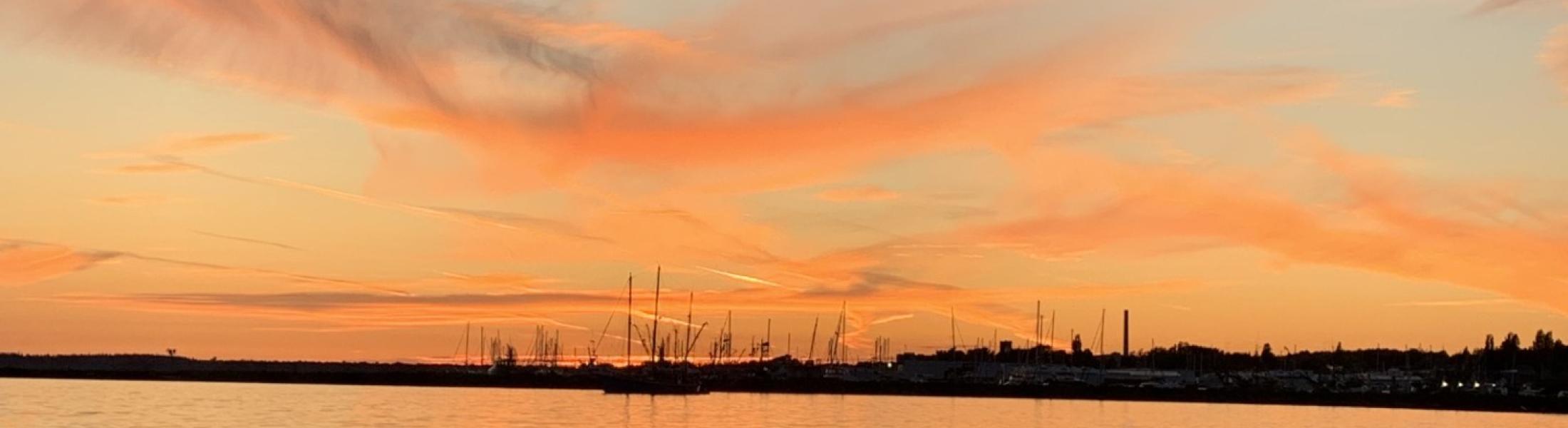 Ocean with sunset over it
