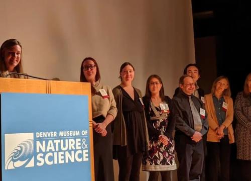 Group of people on stage and a podium