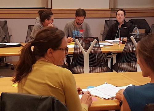 Adults in a classroom setting working together
