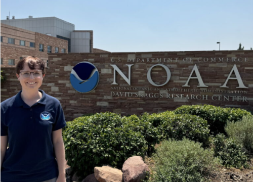 Leah standing in front of NOAA building 