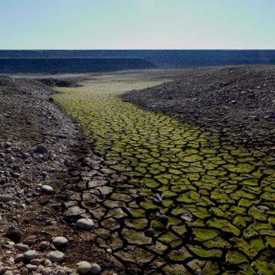 River that has been dried up, there are lots of rocks and cracks in the land