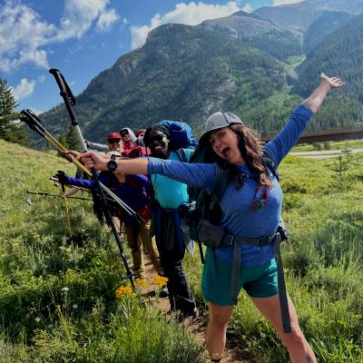 Girls smiling with their arms in the air