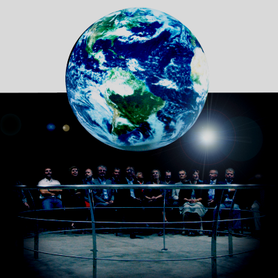 SOS globe display with people the crowd looking up at it