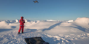 Person in the Arctic flying a dron