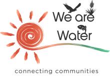 “Logo for ‘We Are Water.’ On the left is a stylized orange spiral sun with paint-stroke rays. To the right, the words ‘We are Water’ appear in dark gray, with small icons integrated above and between the words: a flying bird, a desert plant, and a fish. A flowing brushstroke in orange to teal runs beneath the text. Below, the tagline reads ‘connecting communities.’”